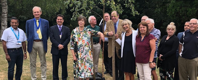 Planting a silver birch tree at Greenways