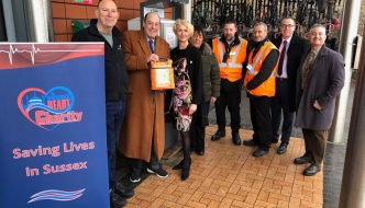 Sir Nicholas with Steve Morris, Charity Life Support Trainer and local campaigner, promoting life-saving equipment at East Grinstead Station