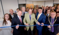 Sir Nicholas cuts the ribbon at the official opening of Mike Oliver Associates in Haywards Heath.
